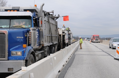 Construction vehicles working on roadway Construction vehicles working on roadway